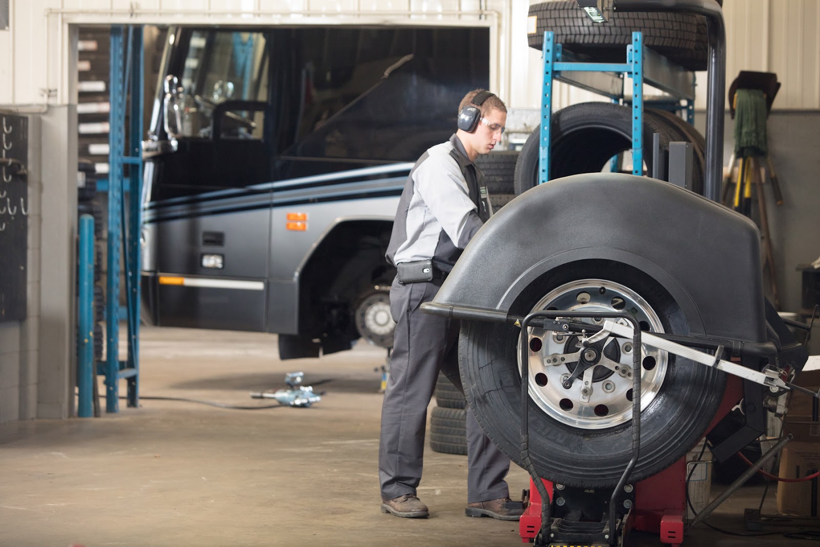 A Wonderland Tire technician is hard at work servicing an RV at the Byron Center location.